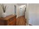 Inviting hallway with hardwood floors leads to various rooms of the home at 5430 Burdette Se Rd, Mableton, GA 30126