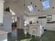 Bright and airy kitchen with an island, white cabinets, and unique green brick flooring at 5430 Burdette Se Rd, Mableton, GA 30126