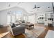 Bright living room with high ceilings, hardwood floors, and abundant natural light at 5430 Burdette Se Rd, Mableton, GA 30126