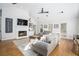 Spacious living room with a fireplace, high ceilings, and natural light at 5430 Burdette Se Rd, Mableton, GA 30126