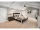 Bright main bedroom features vaulted ceilings, carpeted floors, and neutral decor at 5430 Burdette Se Rd, Mableton, GA 30126