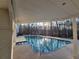 Backyard pool area surrounded by mature trees and with adjacent brick patio area at 5430 Burdette Se Rd, Mableton, GA 30126