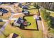 Aerial view showcases the property, including the home, fenced yard with pool, and detached garage at 363 Safe Harbor Dr, Dallas, GA 30157