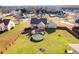 Aerial view showcases the fenced backyard with deck and above-ground pool, ideal for outdoor enjoyment at 363 Safe Harbor Dr, Dallas, GA 30157