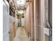 Unfinished basement hallway showing plumbing and electrical access at 363 Safe Harbor Dr, Dallas, GA 30157