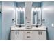This bathroom features double sinks with granite counters and undermount sinks, and shaker style cabinets at 363 Safe Harbor Dr, Dallas, GA 30157