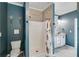 This bathroom features a toilet and shower with tile surround, and double sink vanity at 363 Safe Harbor Dr, Dallas, GA 30157