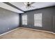 Neutral bedroom featuring two windows, carpeted floors, and plenty of natural light at 363 Safe Harbor Dr, Dallas, GA 30157