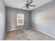 Bedroom features neutral carpeting, and a ceiling fan at 363 Safe Harbor Dr, Dallas, GA 30157