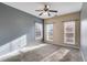 Sun-filled bedroom with carpet flooring and large windows at 363 Safe Harbor Dr, Dallas, GA 30157