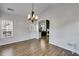 Open-concept dining area with natural light, hardwood floors, and access to the kitchen at 363 Safe Harbor Dr, Dallas, GA 30157