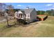 View of the side of the home featuring a large lawn and a wooden fence at 363 Safe Harbor Dr, Dallas, GA 30157
