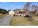 Charming single-Gathering home with a well-maintained lawn and a detached two-car garage at 363 Safe Harbor Dr, Dallas, GA 30157