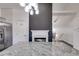 Modern kitchen with granite countertop, stainless steel appliances, and a stylish fireplace at 363 Safe Harbor Dr, Dallas, GA 30157