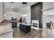 This open-concept kitchen features granite counters, stainless appliances, and a black island at 363 Safe Harbor Dr, Dallas, GA 30157