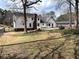Spacious backyard featuring grass, privacy fence, and home exterior at 3750 Clubhouse Se Ln, Conyers, GA 30094
