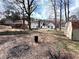 Large backyard with a storage shed, grassy area, and mature trees at 3750 Clubhouse Se Ln, Conyers, GA 30094