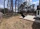 Backyard featuring a concrete patio, and shade trees at 3750 Clubhouse Se Ln, Conyers, GA 30094