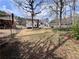 Spacious fenced backyard with grassy area and mature shade trees at 3750 Clubhouse Se Ln, Conyers, GA 30094