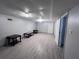 Unfinished basement area, featuring light gray floors, neutral walls, and modern lighting at 3750 Clubhouse Se Ln, Conyers, GA 30094