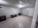 Spacious finished basement area with furniture, new floors and neutral colors at 3750 Clubhouse Se Ln, Conyers, GA 30094