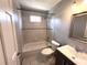 Bathroom showcasing tiled shower, tub, toilet and vanity with sink at 3750 Clubhouse Se Ln, Conyers, GA 30094