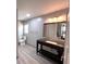 Bathroom featuring a vanity, toilet, and a mirror showing the bedroom at 3750 Clubhouse Se Ln, Conyers, GA 30094