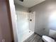 A bathroom featuring a shower with a handheld shower head at 3750 Clubhouse Se Ln, Conyers, GA 30094