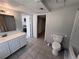 Bathroom featuring vanity with sink, toilet, and tub shower combo at 3750 Clubhouse Se Ln, Conyers, GA 30094