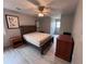 Bedroom featuring a wooden bed frame, ceiling fan, and two side tables at 3750 Clubhouse Se Ln, Conyers, GA 30094