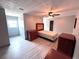 This bedroom features neutral walls, a ceiling fan, and wood-look flooring at 3750 Clubhouse Se Ln, Conyers, GA 30094