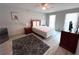 Bright bedroom with neutral paint and light-colored wood-look flooring providing ample space at 3750 Clubhouse Se Ln, Conyers, GA 30094