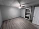 Bedroom area, featuring light gray floors, neutral walls, a ceiling fan and modern door at 3750 Clubhouse Se Ln, Conyers, GA 30094