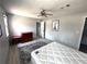 This bedroom features neutral walls, light wood-look flooring, and two windows at 3750 Clubhouse Se Ln, Conyers, GA 30094