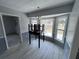 Dining room with bay windows and neutral paint, with easy access to the kitchen at 3750 Clubhouse Se Ln, Conyers, GA 30094