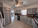Kitchen boasting gray cabinets and neutral countertops, equipped with updated appliances at 3750 Clubhouse Se Ln, Conyers, GA 30094