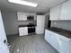 Kitchen with white cabinetry, stainless steel appliances, and granite countertops at 3750 Clubhouse Se Ln, Conyers, GA 30094