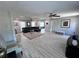 Bright living room with light gray walls and wood floors that create a modern and airy atmosphere at 3750 Clubhouse Se Ln, Conyers, GA 30094