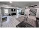 Expansive living room with updated flooring, neutral tones, and ceiling fans, perfect for entertaining at 3750 Clubhouse Se Ln, Conyers, GA 30094