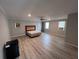 Expansive bedroom with a ceiling fan and new light-colored wood-look flooring at 3750 Clubhouse Se Ln, Conyers, GA 30094