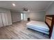 Spacious bedroom with ample closet space and new light-colored wood-look flooring at 3750 Clubhouse Se Ln, Conyers, GA 30094