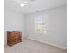 Bedroom with a dresser, window that allows natural light into the room, and carpet at 4140 Hillsborough, Cumming, GA 30041