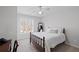Cozy bedroom features a comfortable bed with a decorative pillow and bright window at 4140 Hillsborough, Cumming, GA 30041