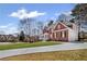 Beautiful brick home with a well-manicured lawn and a long driveway leading to a charming garage at 4140 Hillsborough, Cumming, GA 30041