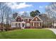 Charming brick home with a manicured lawn and inviting front porch, perfect for relaxing and enjoying the neighborhood at 4140 Hillsborough, Cumming, GA 30041