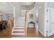 Grand foyer featuring a staircase, hardwood floors, and elegant decor, creating a welcoming entrance at 4140 Hillsborough, Cumming, GA 30041
