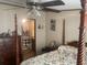 Bedroom featuring a four-poster bed and a view into the en-suite bathroom at 53 Oakview Dr, Carrollton, GA 30116