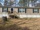 A single-story home featuring a porch and classic exterior siding at 53 Oakview Dr, Carrollton, GA 30116