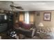Cozy living room with plush furniture, ceiling fan, and natural light at 53 Oakview Dr, Carrollton, GA 30116