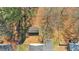Aerial shot showing a landscaped backyard, mature trees, and a detached shed at 539 Villa Rosa Rd, Temple, GA 30179
